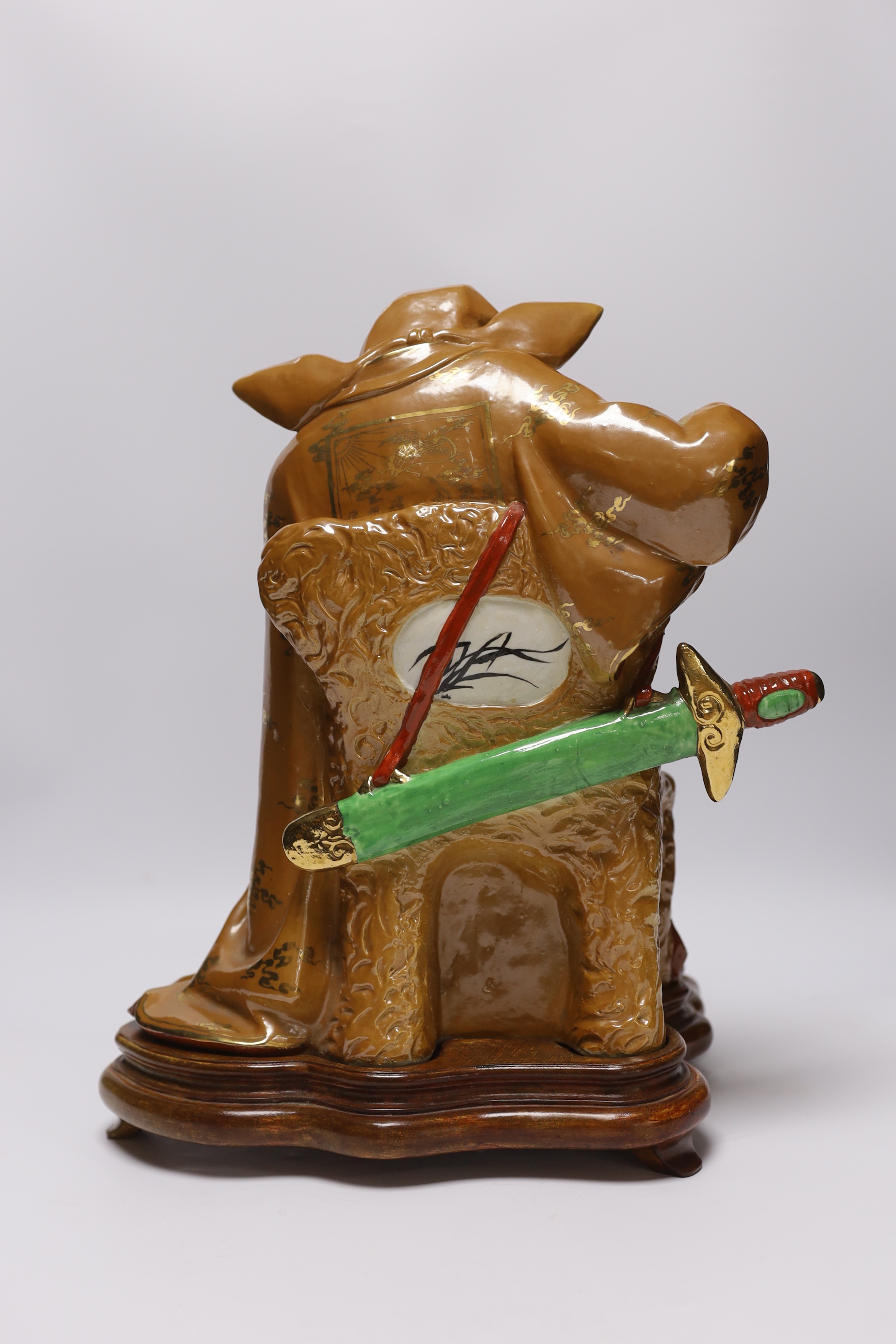 A Chinese enamelled porcelain figure of Li Bai on stand, third quarter 20th century, 39cm high
